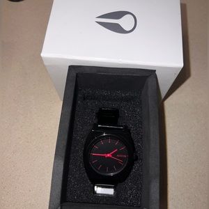 Black & pink Nixon Time Teller P watch